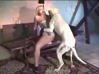 Brunette woman and her dog in a beastly video