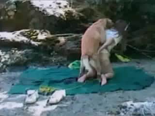 Curvy woman demonstrating her intimate abilities in an adult film featuring a dog