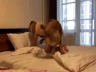 German Shepherd asserts control over blonde owner in doggy style