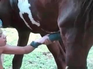Hot pervert is playing wild games with a horse