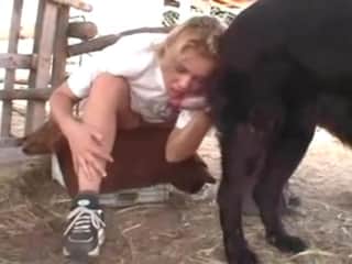 Blonde beauty and her dog outside